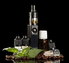 Electronic Cigarette, Bottles With Liquid For Smoking, Near Coffee Beans Isolated On Black Stock Photo