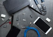 Smartphones And Router With The Necessary Parts And Tools To Connect, On Gray Royalty Free Stock Photo