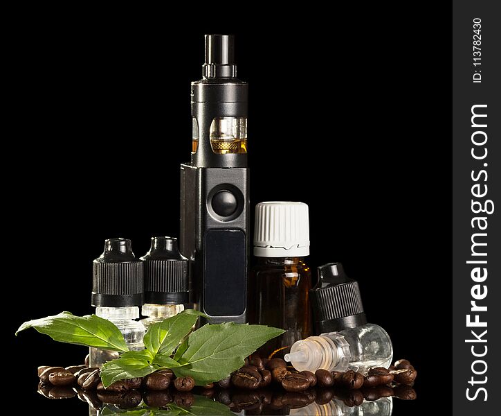 Electronic cigarette, bottles with liquid for Smoking, near coffee beans isolated on black