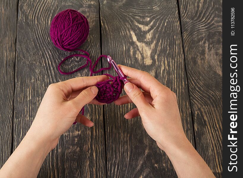 Hand made, crochet materials, on dark wooden surface. Hand made, crochet materials, on dark wooden surface