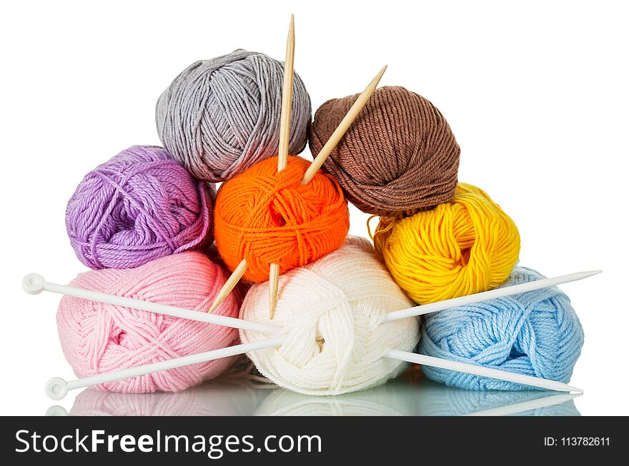 Skeins of multicolored yarn and needles for hand knitting isolated on white background