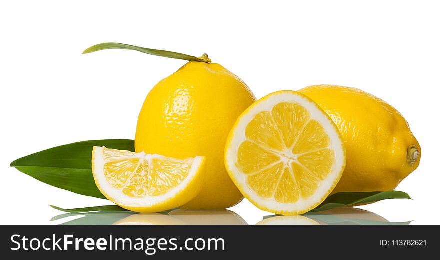 Two whole lemons with leaves and pieces isolated on white background