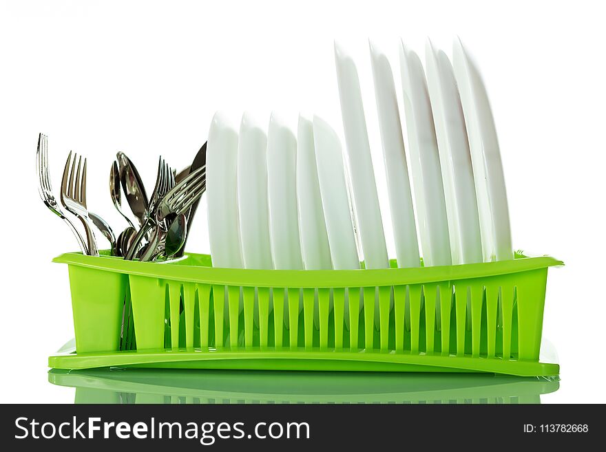 Cutlery And Plates On Green Dryer Isolated On White