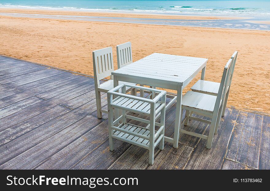 Wood floor and seaside table with beach and sea background.