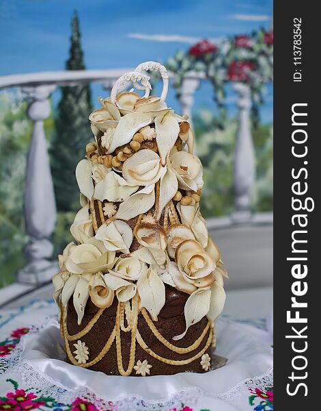 Wedding loaf.wedding bows made of yeast dough, high decorated with flowers