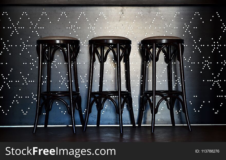 Bar counter with high chairs in cozy restaurant