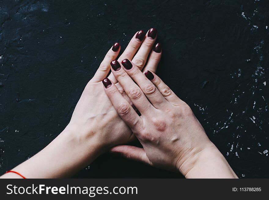 Woman hands with new nails on table. Woman hands with new nails on table