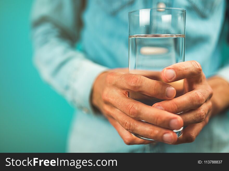 Man holding a glass of water