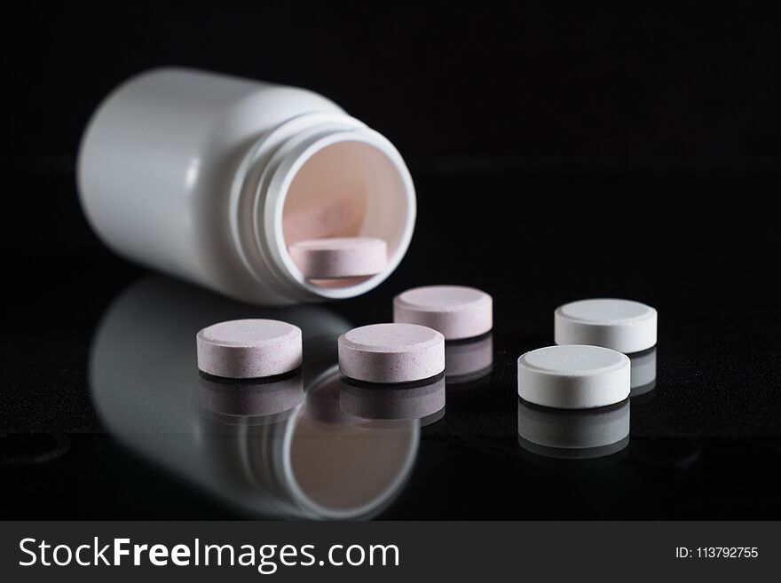 Tablets And Pills On Dark Background