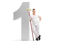 Painter Holding A Paint Roller And Leaning Against A Number One Royalty Free Stock Photo