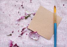 Note Mock Up For Artwork With Brushes And Purple Rose Petal Royalty Free Stock Image