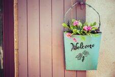 Green Basket With Welcome And Flower Royalty Free Stock Images Green Basket With Welcome And Flower Royalty Free Stock Images