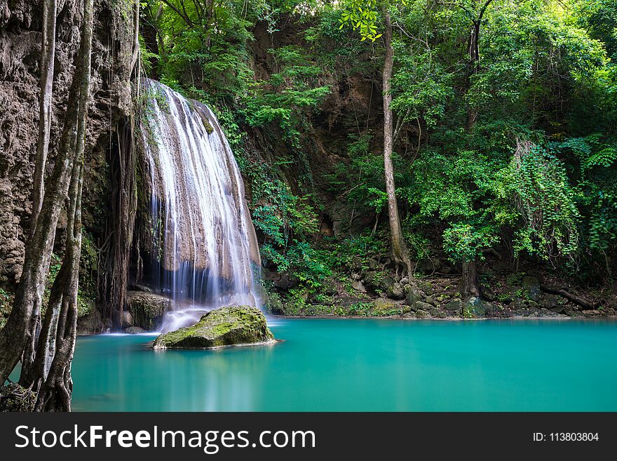 Waterfall in Thailand name Erawan, forest environment with big tree and emerald water at Kanchanaburi provience. Waterfall in Thailand name Erawan, forest environment with big tree and emerald water at Kanchanaburi provience