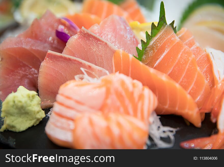 Sashimi Set With Different Fresh Fish Sliced On Plate