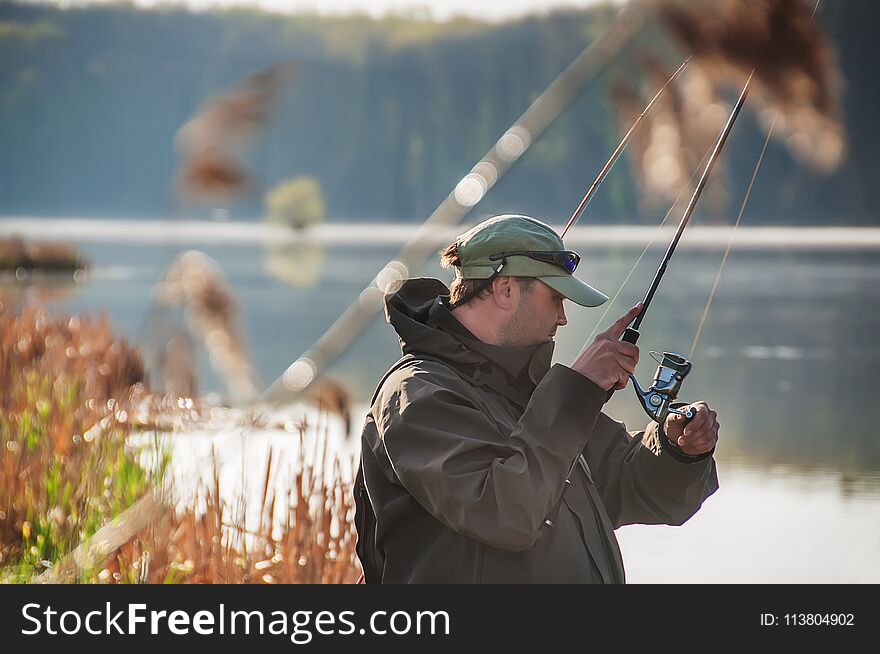 A fisherman with a spinning in his hand