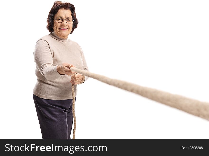 Elderly woman pulling a rope isolated on white background