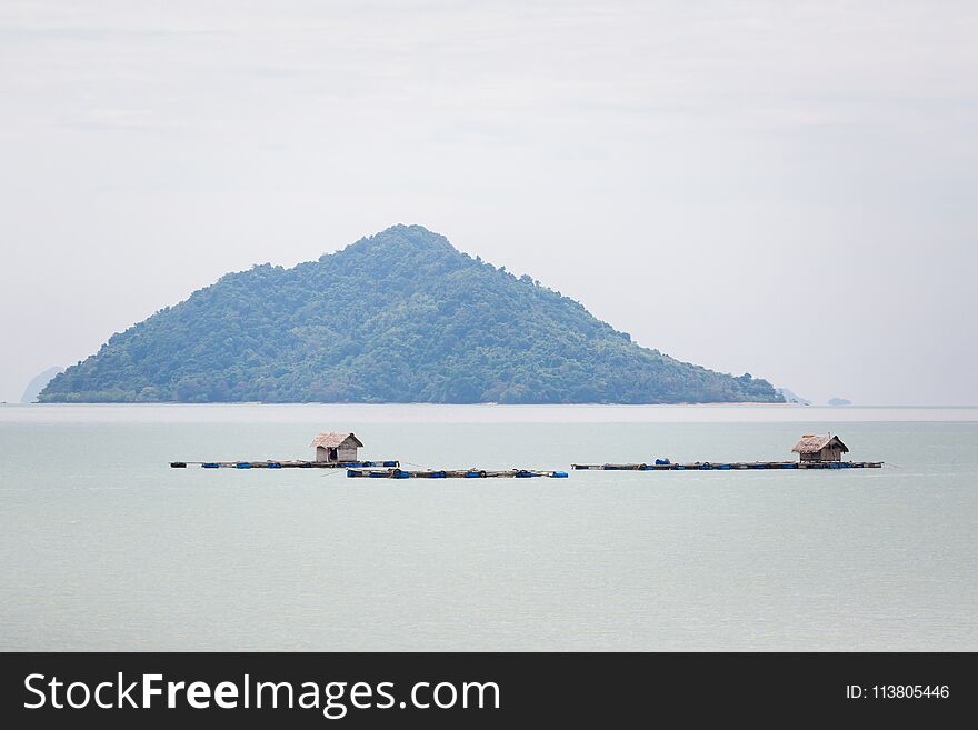 Summer landscape on tropical koh Lanta Noi island in Thailand. Seascape with floating village huts. Summer landscape on tropical koh Lanta Noi island in Thailand. Seascape with floating village huts.