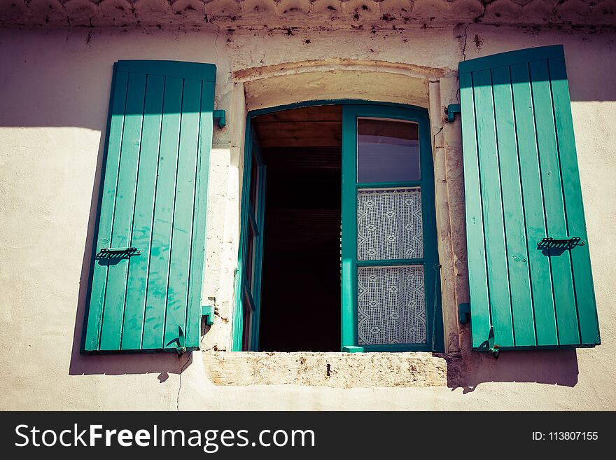 Closeup on colorful shutters on old window