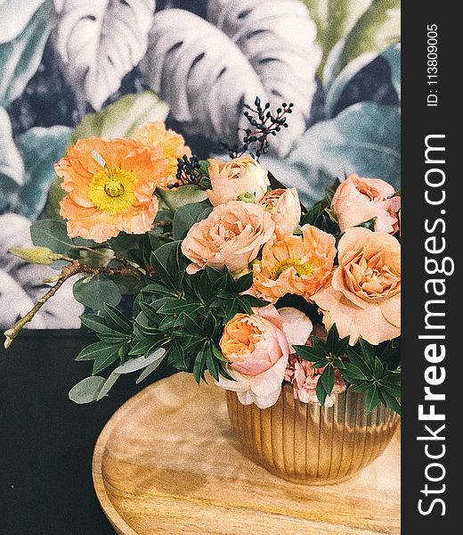 Peach Peony Flowers and Pink Poppy Flowers in Vase on Table Centerpiece