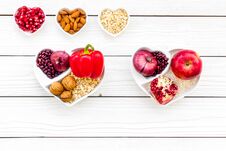 Diet For Healthy Heart. Food With Antioxidants. Vegetables, Fruits, Nuts In Heart Shaped Bowl On White Wooden Background Royalty Free Stock Photography Diet For Healthy Heart. Food With Antioxidants. Vegetables, Fruits, Nuts In Heart Shaped Bowl On White Wooden Background Royalty Free Stock Photography