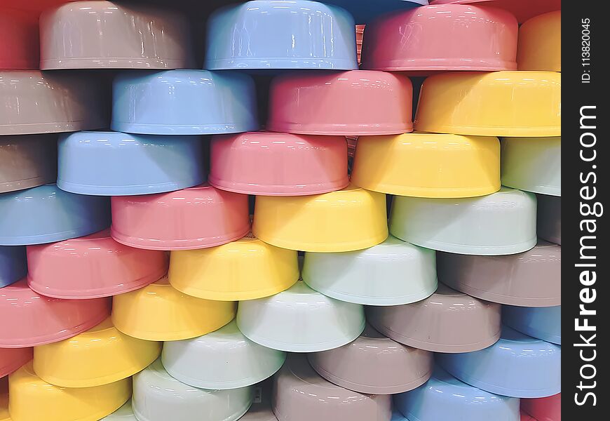 Full Frame Background of Staggered Colorful Plastic Bowls