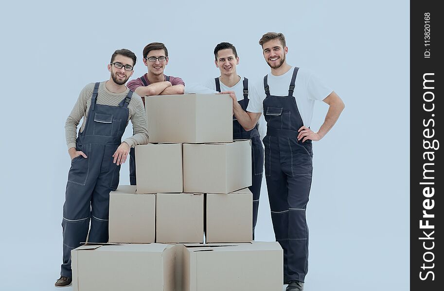 Men holding pile of carton boxes on white background. Men holding pile of carton boxes on white background