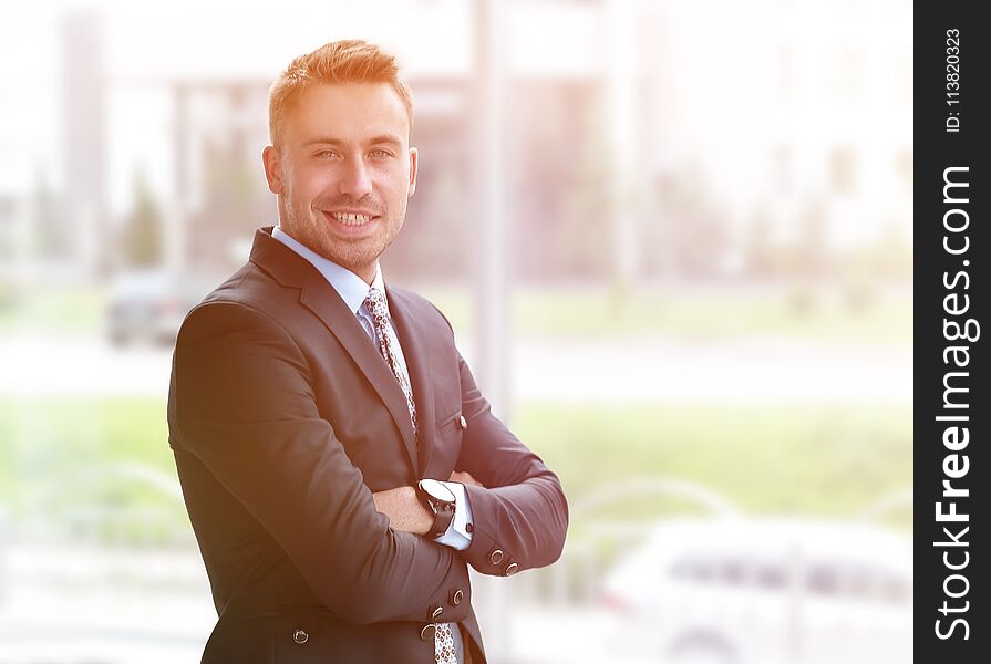 Side view.portrait of confident businessman looking out the window of the office. photo with copy space