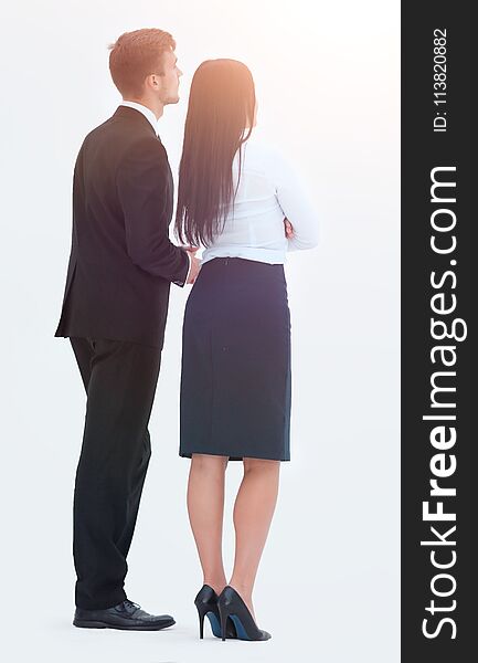 Rear View. Businessman And Business Woman Standing Next To And Looking Forward.