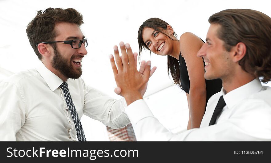Business colleagues giving each other high five. concept of success.photo with copy space