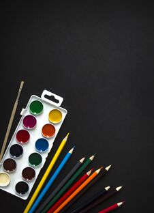 On Dark Background Paint Sheet Brush Pencils Colored Vertical Top View Flat Lay Background Knolling Stock Photography