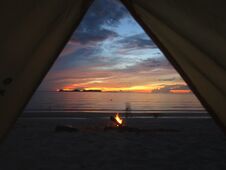 Sunrise View From A Tent In Thailand With Beach Fire Stock Images Sunrise View From A Tent In Thailand With Beach Fire Stock Images