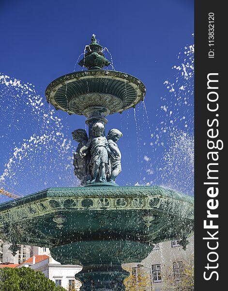 Baroque style fountain in Rossio Square Lisbon