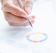 Woman Hand With Pen And Business Report Stock Photos
