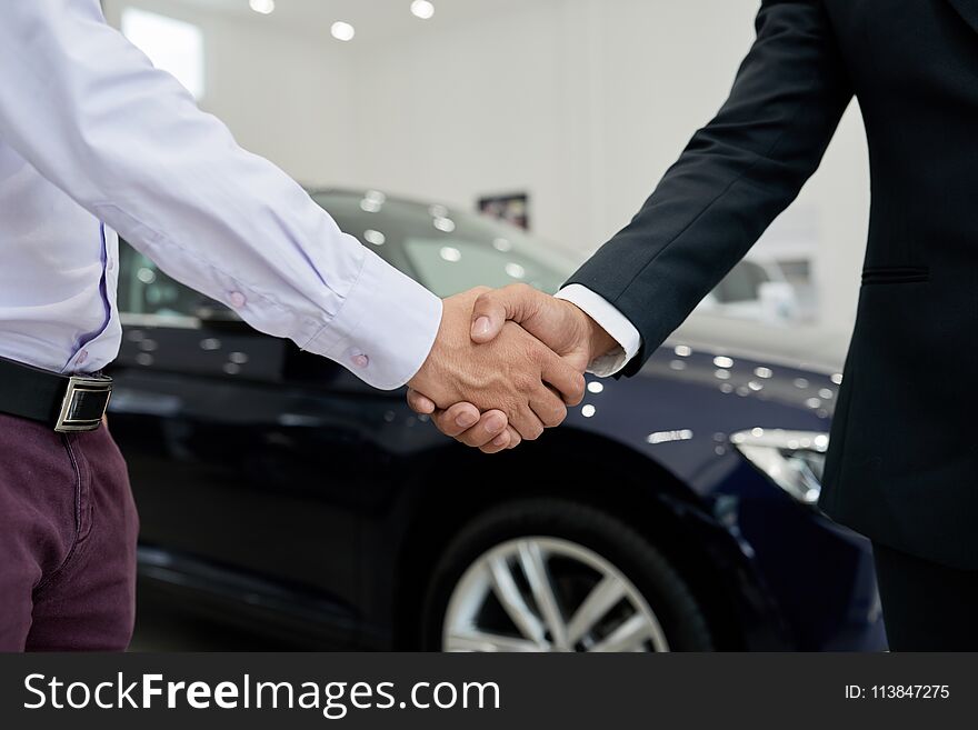 Customer and seller shaking hands to confirm a deal. Customer and seller shaking hands to confirm a deal
