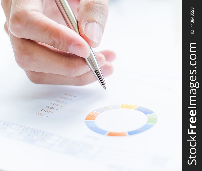 woman hand with pen and business report sign in paper