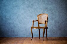 Old Chair On A Gray Wall Background. Royalty Free Stock Photography Old Chair On A Gray Wall Background. Royalty Free Stock Photography
