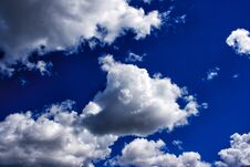 White Clouds In The Bright Blue Sky Stock Image