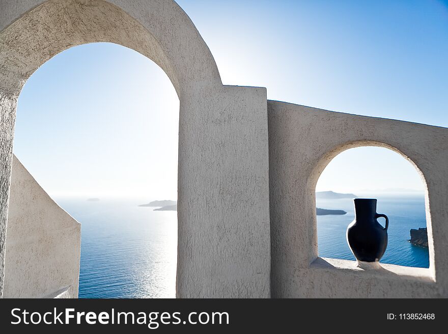 Beautiful old white ortodox church in sunny day with blue sky in Oia on Santorini island. Santorini is romantic place, one of the most visited Greek islands. Beautiful old white ortodox church in sunny day with blue sky in Oia on Santorini island. Santorini is romantic place, one of the most visited Greek islands