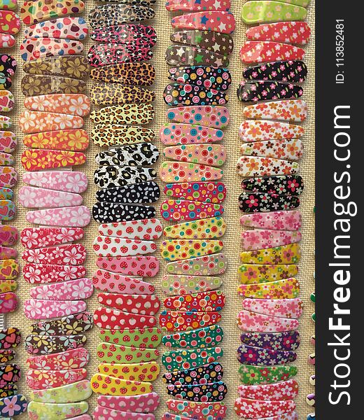 Pairs of colorful hair clips offered for sale
