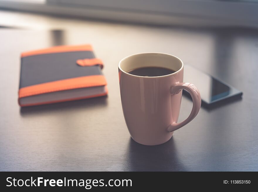 Coffee break business. Cup of coffee mobile phone and notepad. Coffee time. Morning coffee time. Coffee break business. Cup of coffee mobile phone and notepad. Coffee time. Morning coffee time