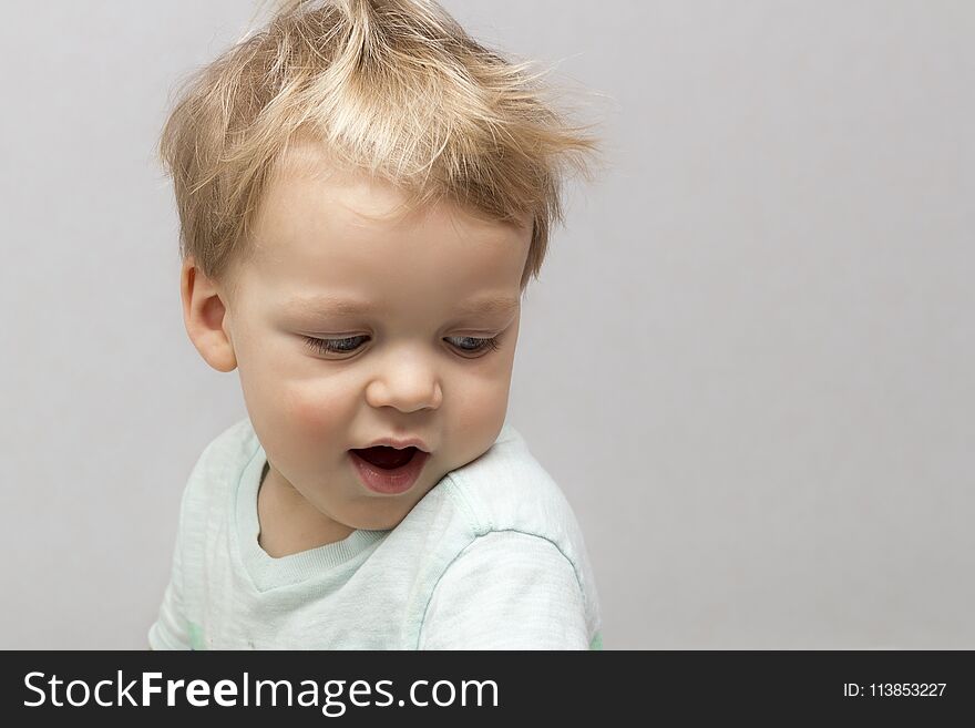 Cute Two Years Toddler In Sleepwear On The Grey Background.