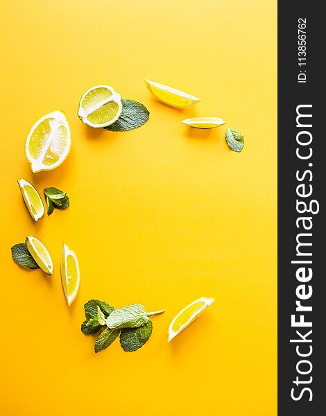 Bright Mint Leaves And Lemon Slices On Yellow