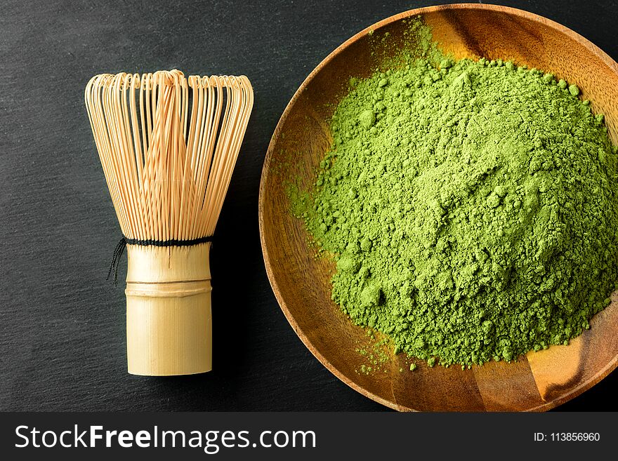 Japanese green tea matcha in a wooden bowl