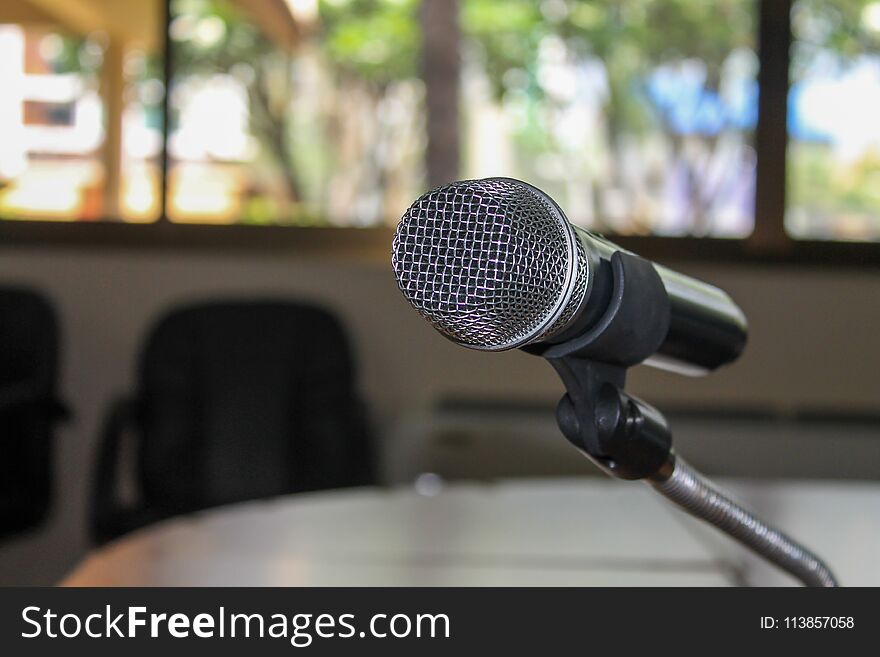 Close up of Microphone in conference room blur Background