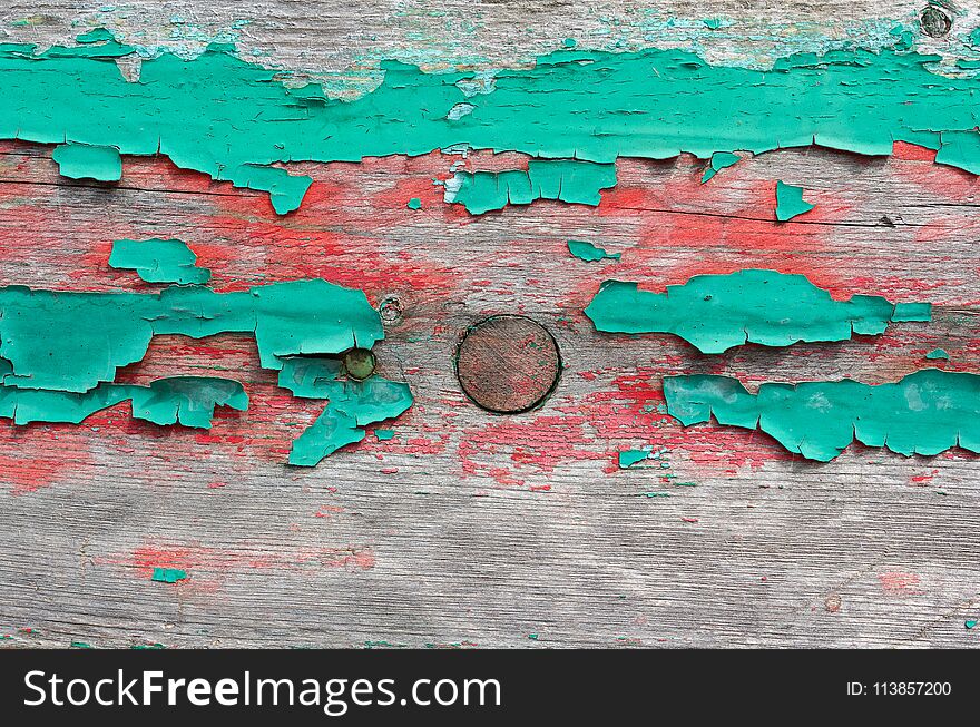 Old board with the remains of paint. Backgrounds and textures