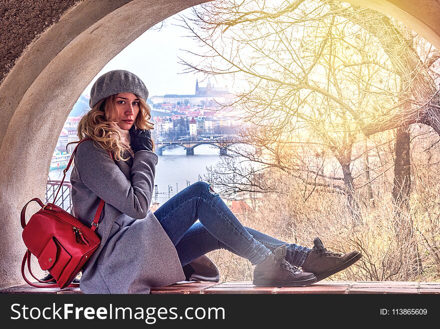 Woman In Prague, Czeh Republic. Beautiful Blonde Lady. Castle And Charles Bridge Background View