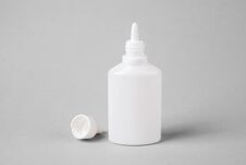 Spray For The Nose In A White Plastic Bottle On A Gray Background. Aerosol From The Common Cold Or Allergy Royalty Free Stock Photo