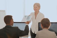 Senior Manager, Handing The Employee A Document With Financial Data. Stock Photo