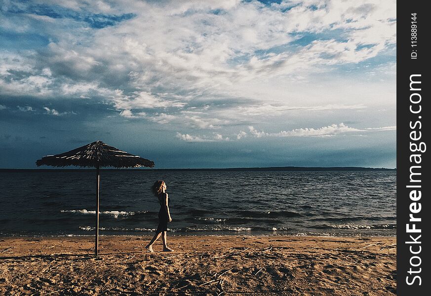 Girl Against The Background Of The Lake