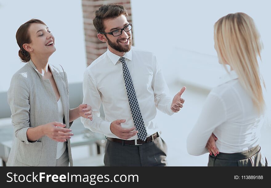 Manager and business team talking in the office.